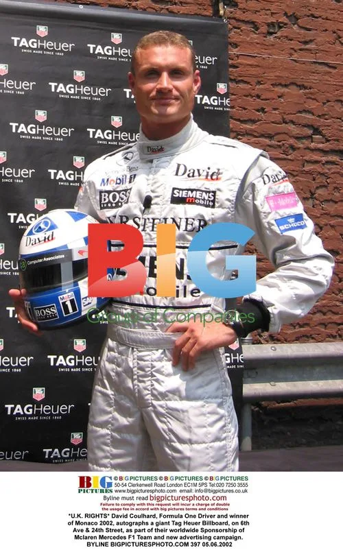 David Coulthard autographs Tag Heuer billboard