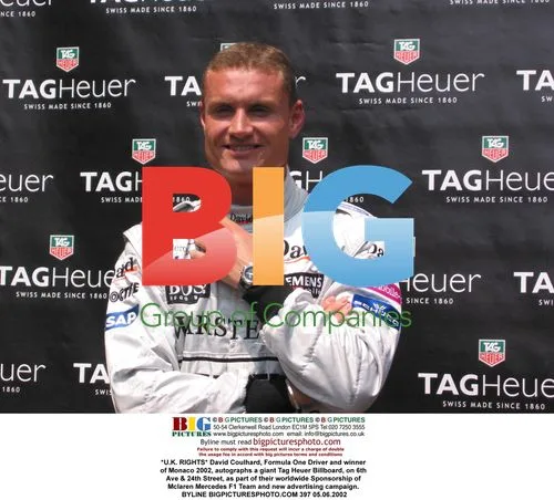 David Coulthard autographs Tag Heuer billboard