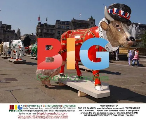 Esther Rantzen poses with Beefeater cow in Trafalgar Square