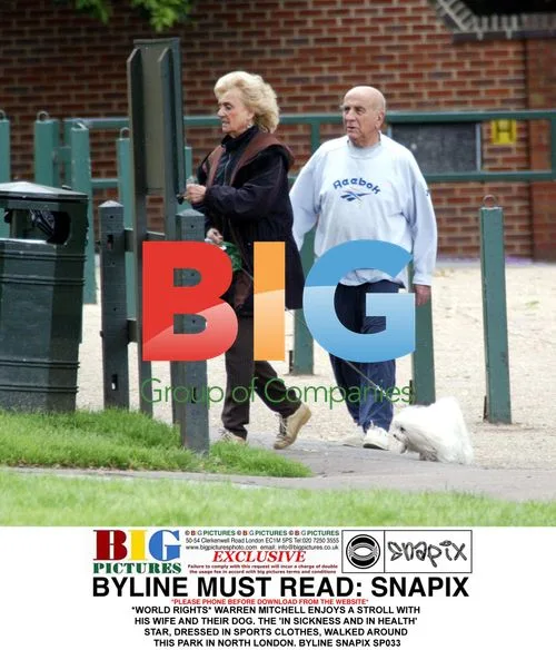 Warren Mitchell Takes Stroll with Wife and Dog