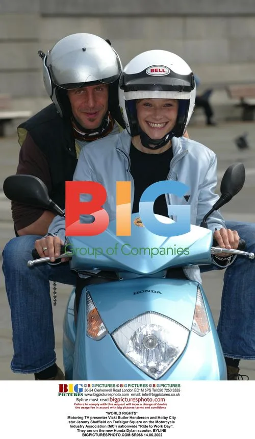 Vicki Butler Henderson and Jeremy Sheffield on Motorcycle