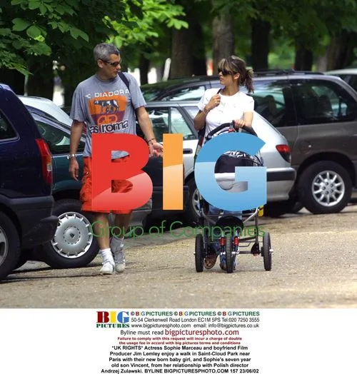 Sophie Marceau and boyfriend Jim Lemley with baby and son
