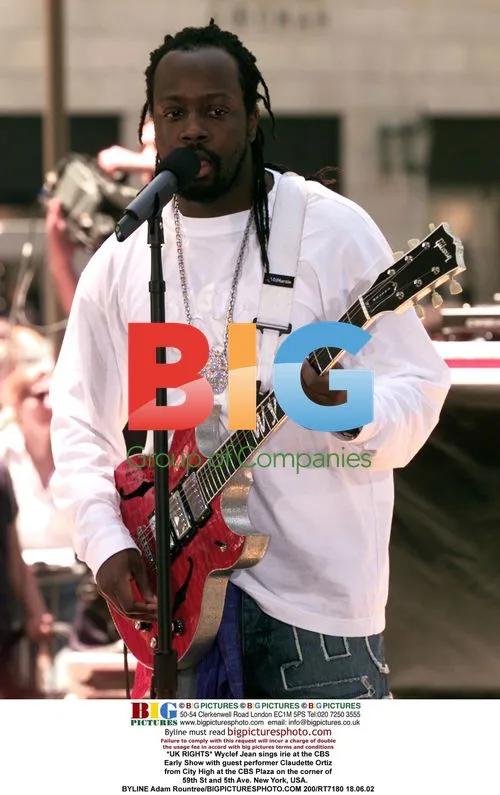 Wyclef Jean performs with Claudette Ortiz at CBS Early Show