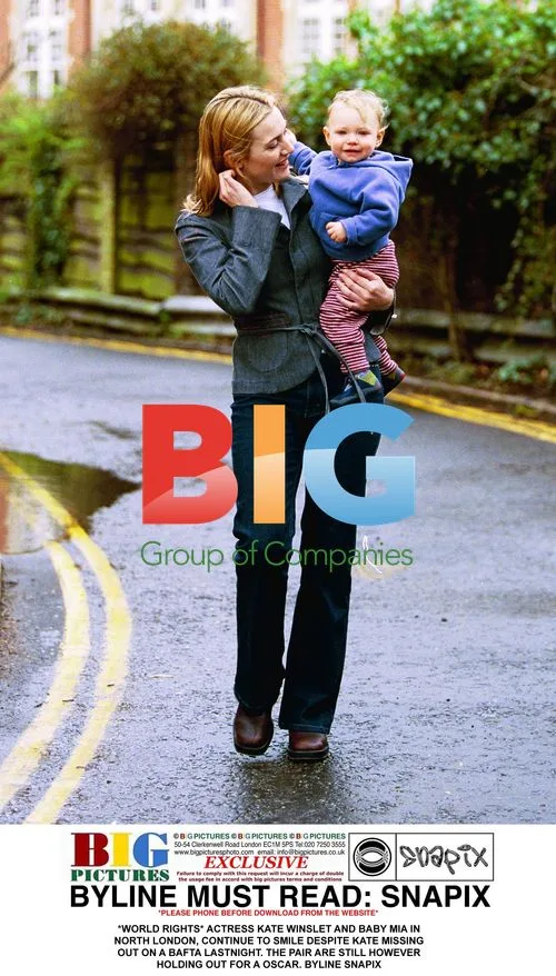 Kate Winslet and baby Mia smile in North London