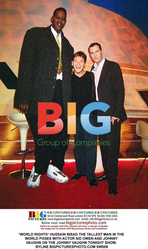 Tallest Man Poses with Celebs on TV Show