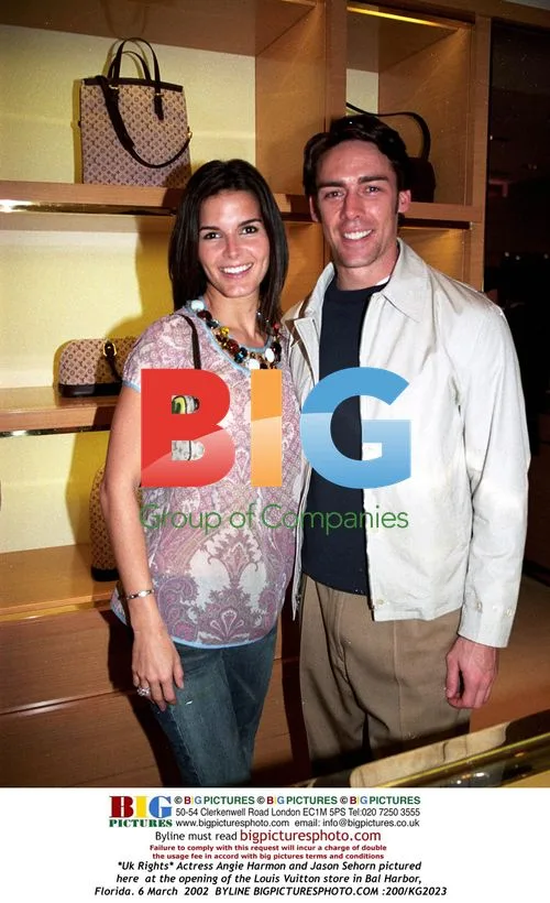 Angie Harmon and Jason Sehorn at Louis Vuitton