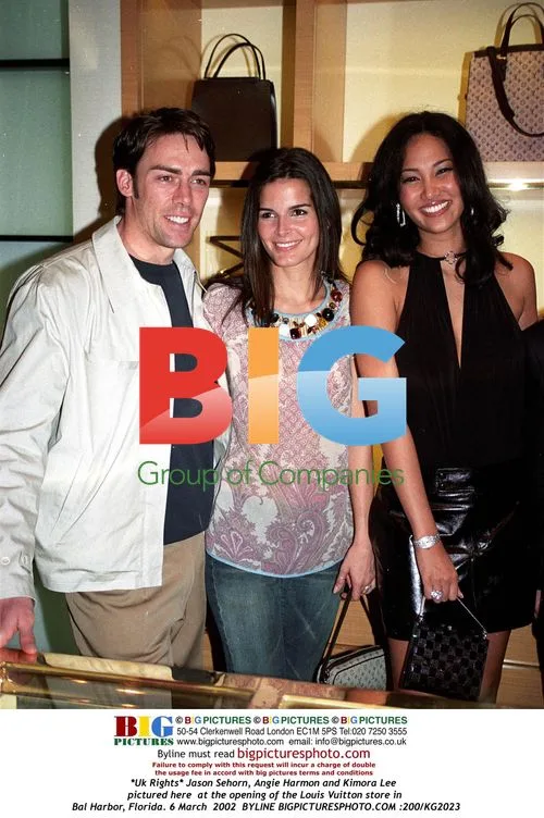 Jason Sehorn, Angie Harmon, Kimora Lee at Louis Vuitton Store Opening
