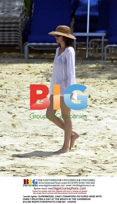 Cindy Crawford Relaxes at Caribbean Beach