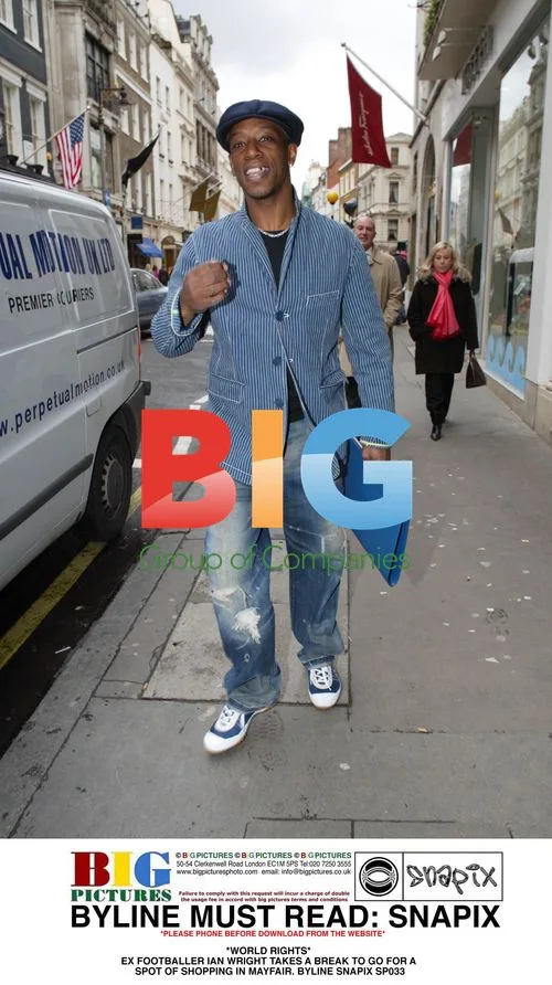 Ian Wright Takes Break for Shopping in Mayfair