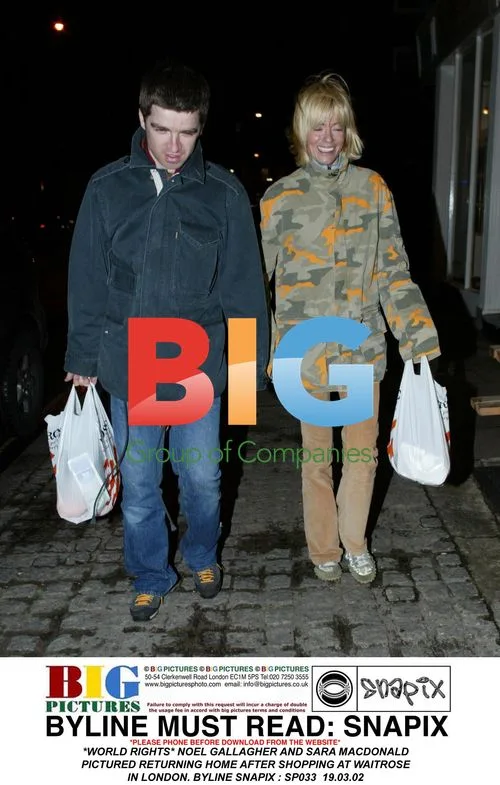 Noel Gallagher and Sara Macdonald return home after shopping