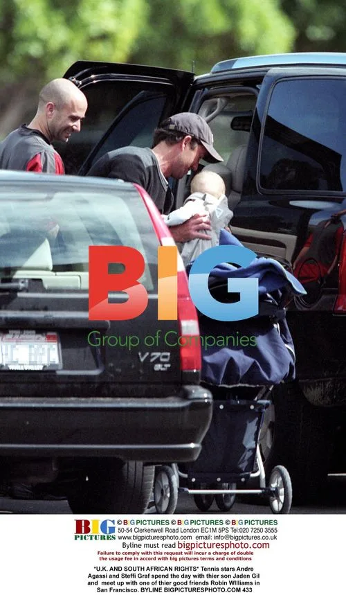 Tennis stars Agassi and Graf with son and Robin Williams