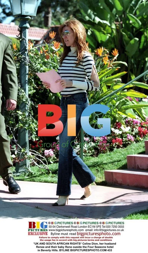 Celine Dion with husband Renee and baby Rene outside Four Seasons hotel