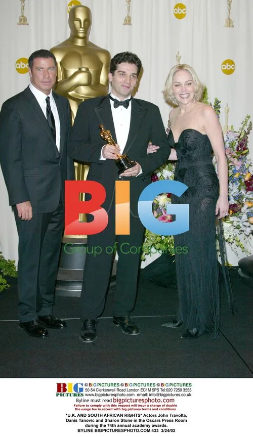 Travolta, Tanovic, and Stone at Oscars Press Room
