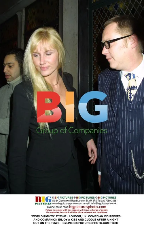 Vic Reeves and Companion Kiss After Night Out