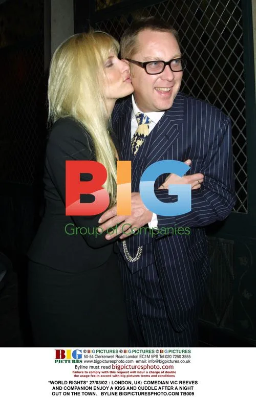 Vic Reeves and Companion in Affectionate Embrace