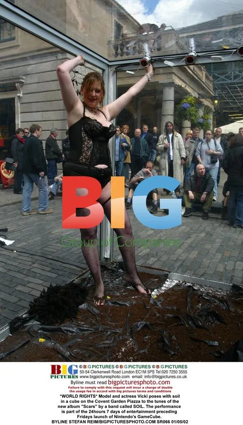 Model Vicki poses with soil on Covent Garden Piazza