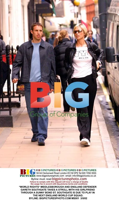 Gareth Southgate strolls with girlfriend