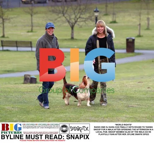SARA COX TAKES SNOOP FOR A WALK