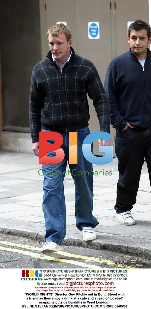 Guy Ritchie enjoys drink and magazine on Bond Street