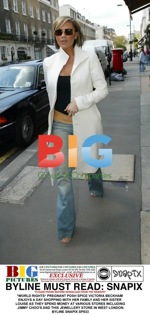 Pregnant Victoria Beckham shops with family