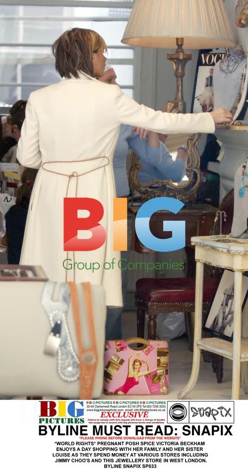Pregnant Victoria Beckham shops with family