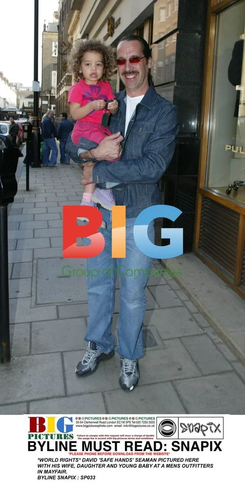 David Seaman and Family at Menswear Store