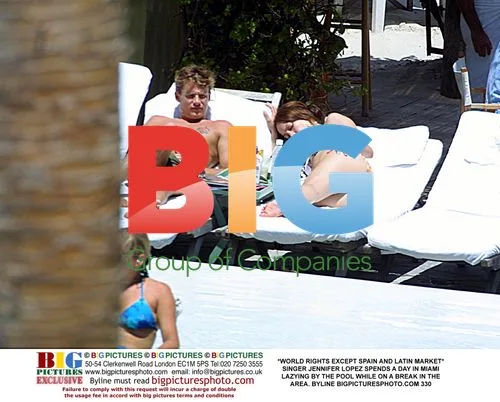 Jennifer Lopez Relaxes by Pool in Miami