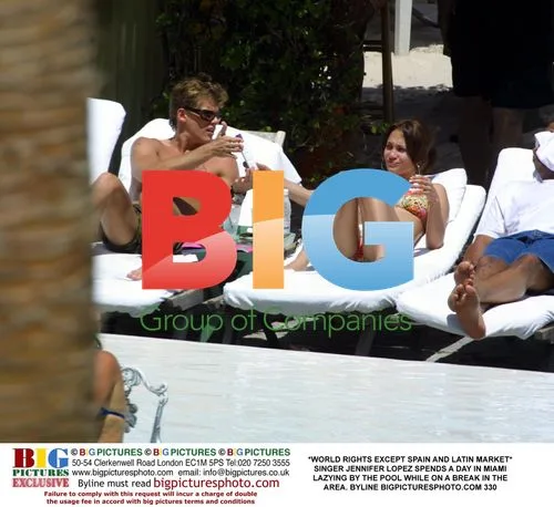 Jennifer Lopez Relaxes by Pool in Miami