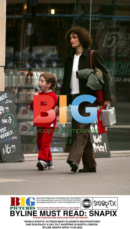 Mary Elizabeth Mastrantonio and son shop in London