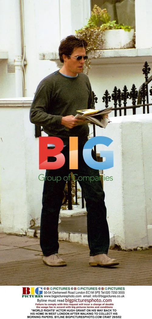 Hugh Grant Collecting Papers in West London