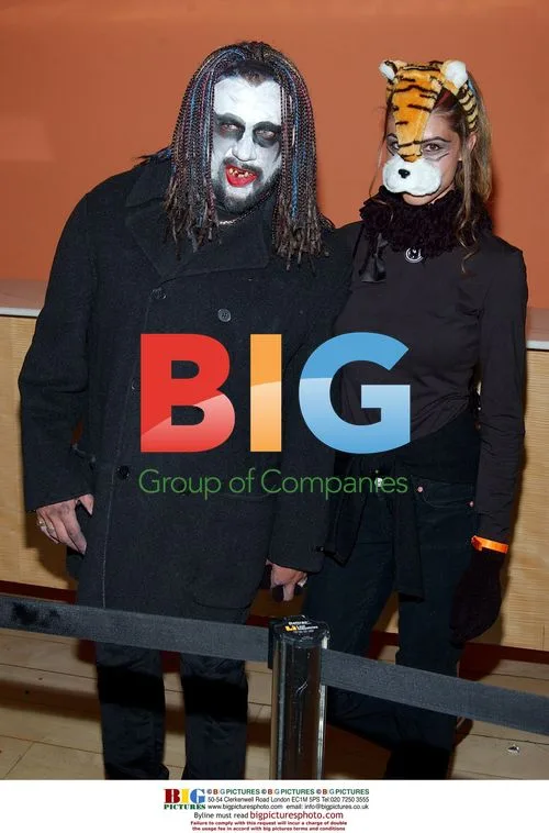 Shannon Elizabeth and husband at Halloween party