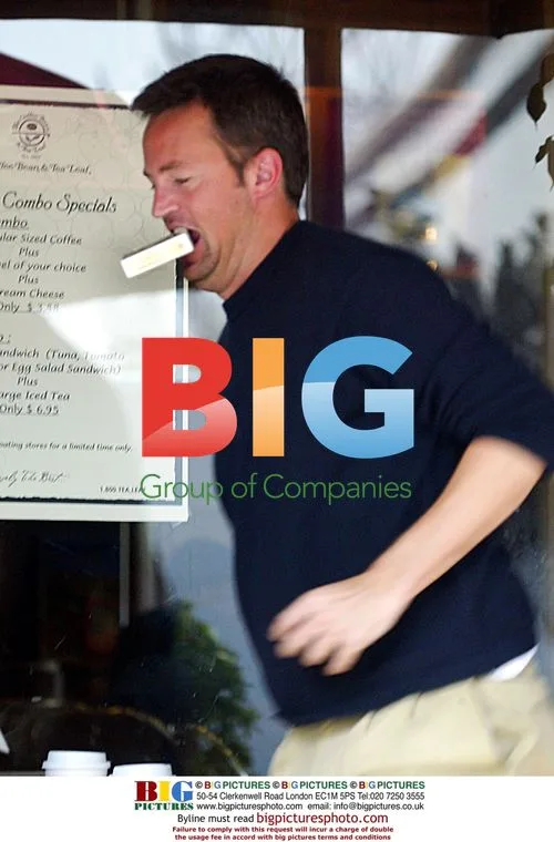 Matthew Perry goofing around with cigarettes