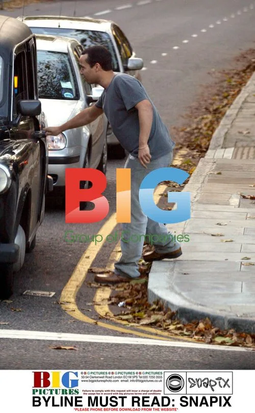 Finley Quaye jumping into taxi in London