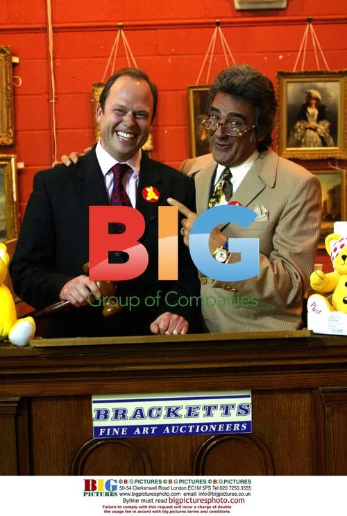 Auctioneer James Braxton and David Dickinson at Children in Need Bargain Hunt Special