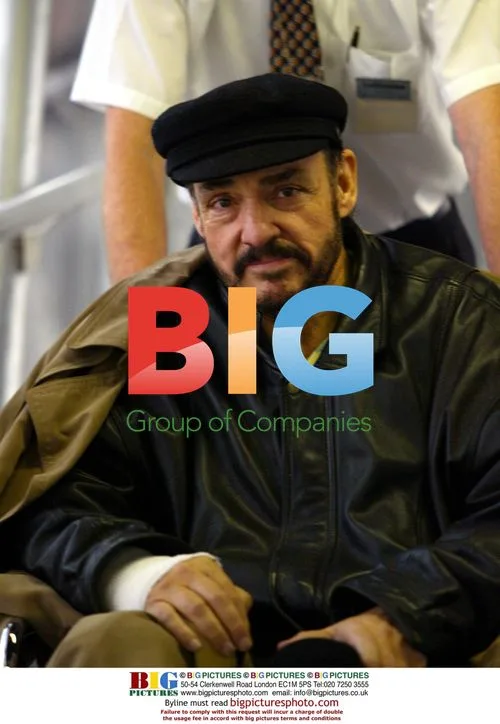 John Rhys-Davies in wheelchair at airport