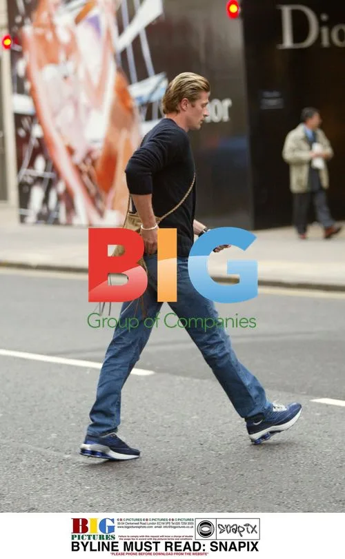 Emmanuel Petit and wife Agathe shopping in London