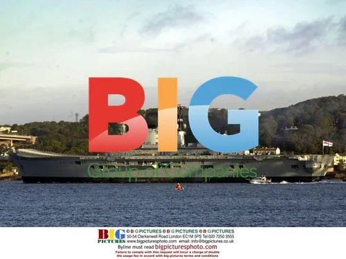 Aircraft Carrier 'Illustrious' Passes Under Bridges