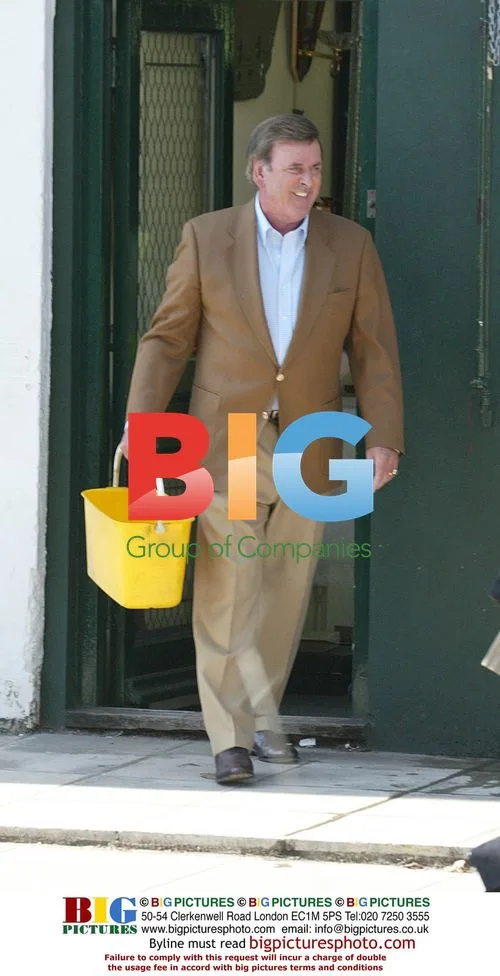 TV Presenter Terry Wogan Helps Window Cleaner