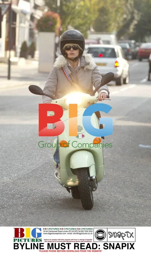 Laura Bailey Riding Vespa in Notting Hill