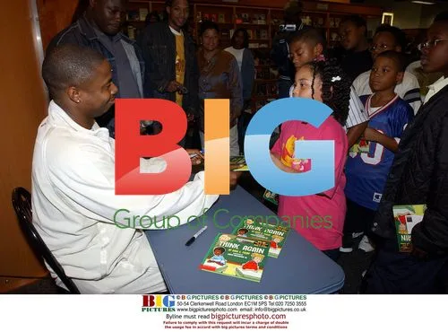Doug E. Fresh signs "Think Again" at Hue-man Bookstore