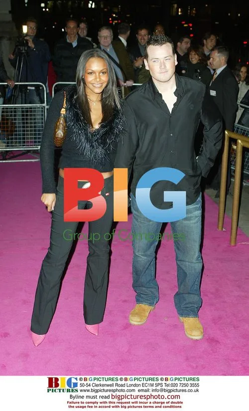 Samantha Mumba and Boyfriend at Versace Retrospective