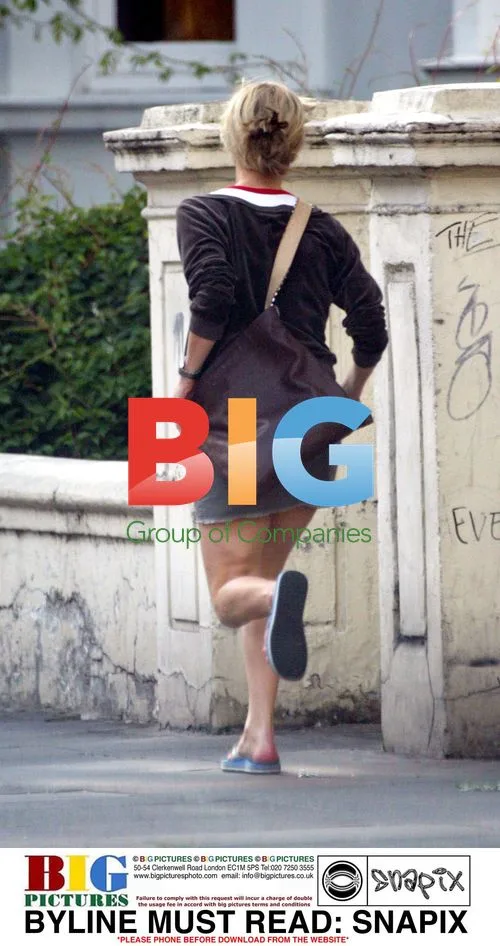 Model Laura Bailey Hurrying in London