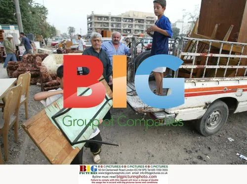 Elderly Iraqi Man Unloads Furniture