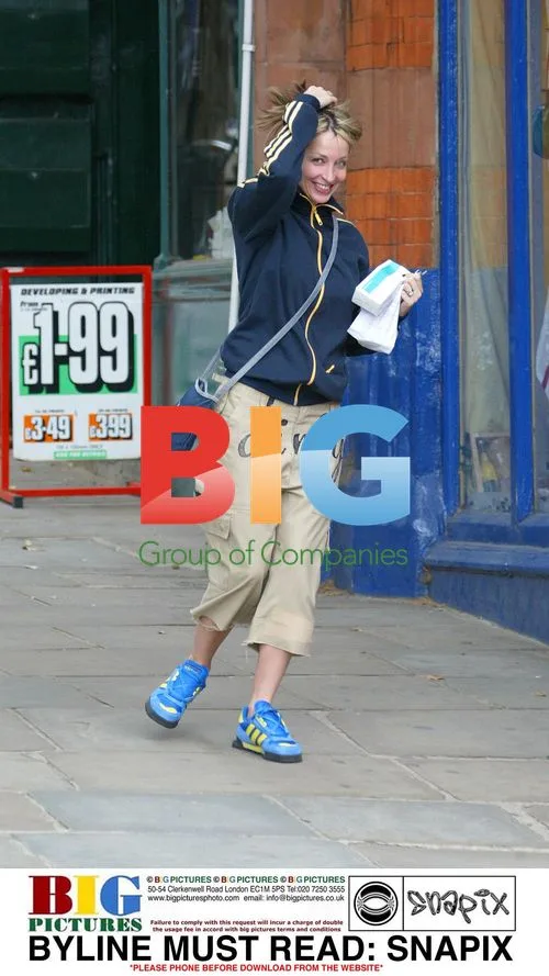 Natalie Appleton Hides From Camera In London