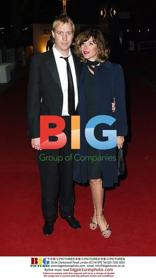 Celebrity attends film theater anniversary bash
