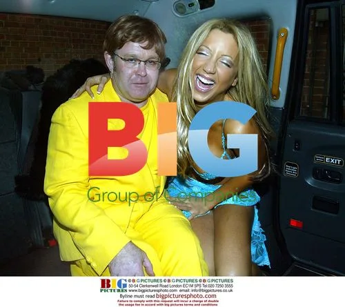 Emma Jones and Elton John Lookalike in Taxi
