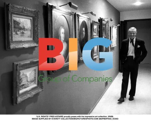 Fred Astaire poses with art collection