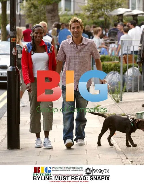 Shaznay Lewis and Fiancee Walk with Puppy