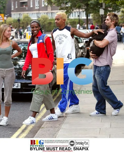 Singer Shaznay Lewis and fiancee Christian out with puppy