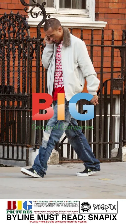 Dan MacMillan Chats on Phone in Notting Hill